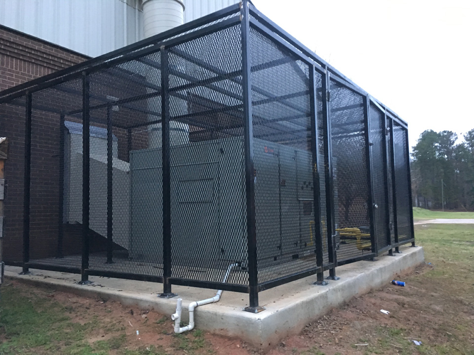 Other side view of large AC cage for commercial property
